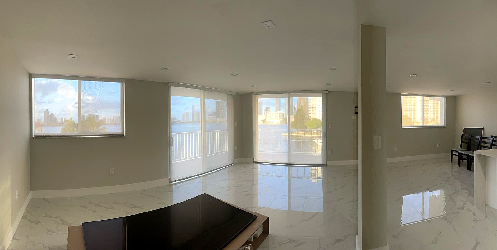 Panoramic view of a condo with solar shades on every window and door
